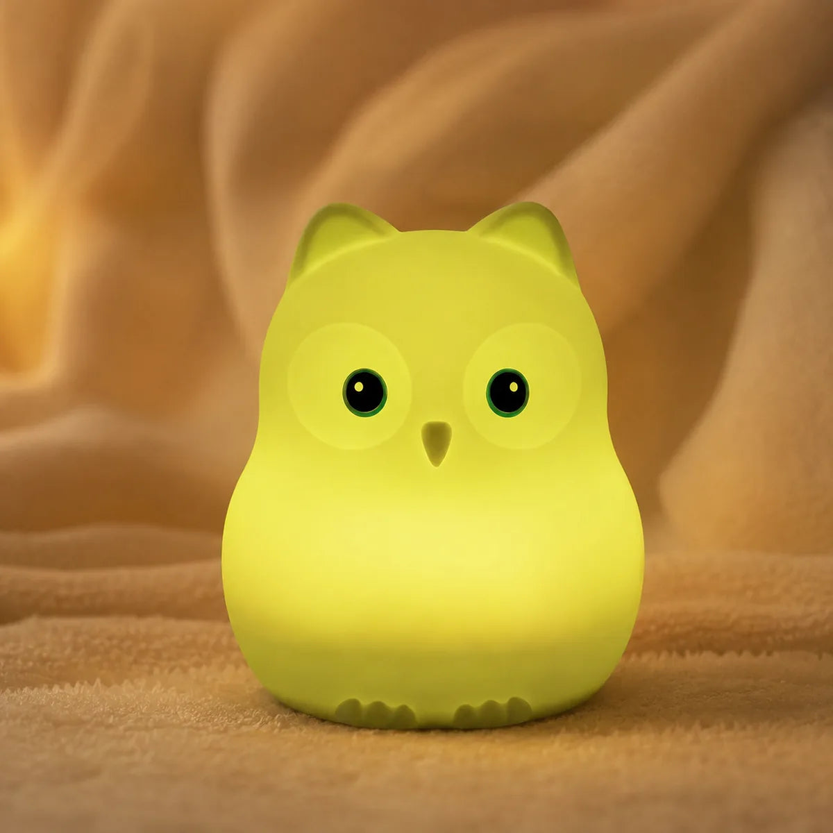 Veilleuse oiseau en silicone en ambiance cosy sur textile doux